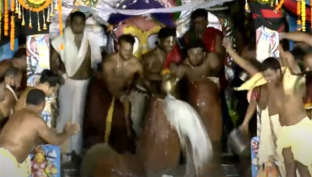 Servitors breaking of the earthen pots after Sodosha Upachara Pooja