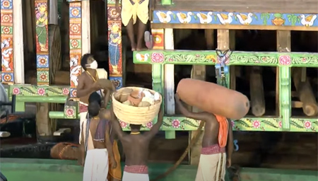 Servitors bringing the earthen pot for Adhara Pana