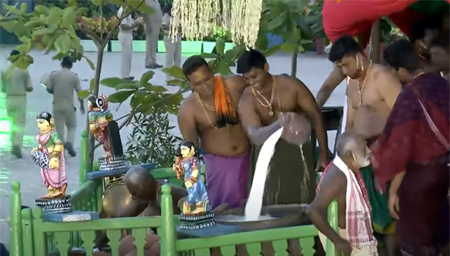 Servitors preparing Adhara Pana in big brass container (Handa) kept on the chariot