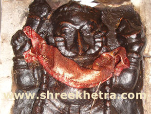 Deity on left side of entrance