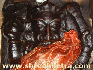 Deity on right side of entrance